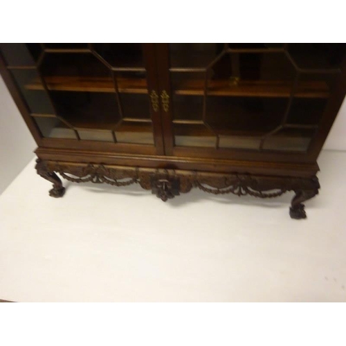 100 - An excellent quality Irish mahogany bookcase, the upper section having dental cornice over sectioned... 