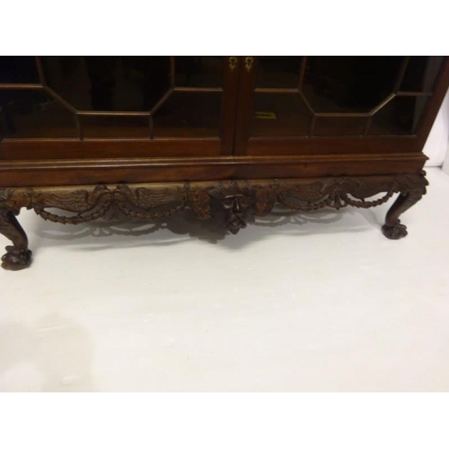 100 - An excellent quality Irish mahogany bookcase, the upper section having dental cornice over sectioned... 