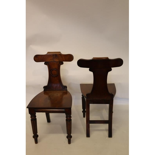 102 - A pair of good antique mahogany hall chairs.