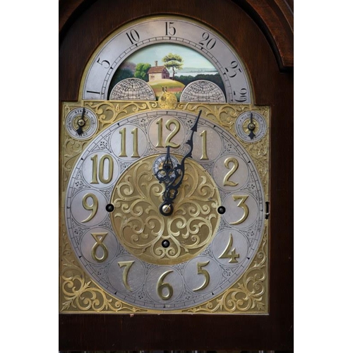 104 - American/German - A fine early 20th century long cased clock, having arched brass dial and moon move... 