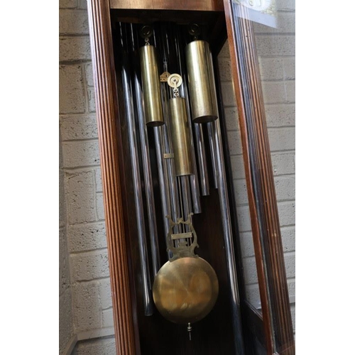 104 - American/German - A fine early 20th century long cased clock, having arched brass dial and moon move... 