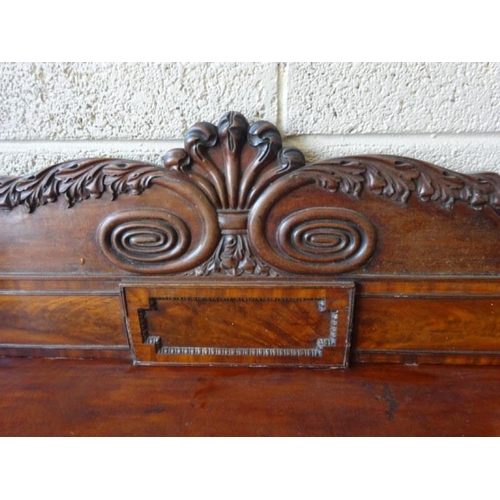 111 - A Regency mahogany drop centre sideboard having nicely carved back panel, the centre section fitted ... 