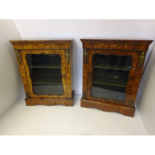 120 - A good pair of Victorian walnut and marquerty inlaid side cabinets having shaped doors and plinth ba... 