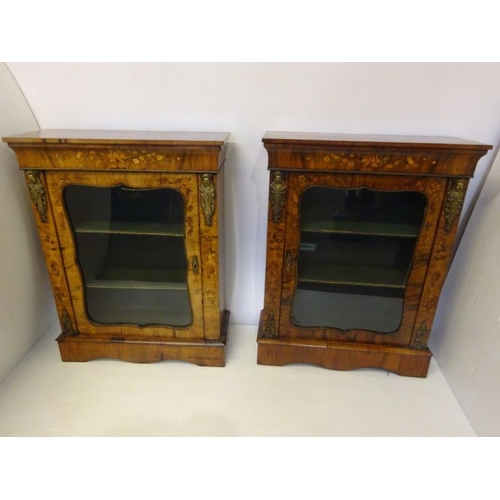 120 - A good pair of Victorian walnut and marquerty inlaid side cabinets having shaped doors and plinth ba... 