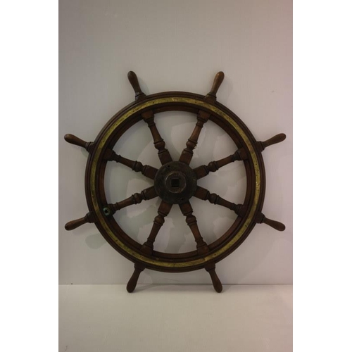 124 - Antique brass bound and oak ships wheel. Diameter 107cm.