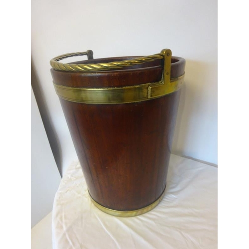 125 - A very good large Irish Georgian mahogany and brass banded turf bucket with rope twist handle. H. 46... 