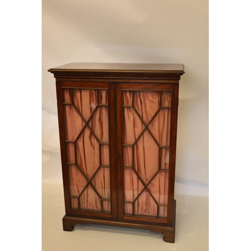 126 - Victorian mahogany cabinet having sectioned glass doors, shelved interior and raised on bracket feet... 