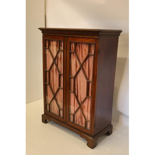 126 - Victorian mahogany cabinet having sectioned glass doors, shelved interior and raised on bracket feet... 