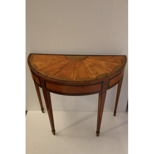 128 - Good antique satinwood fold over card table, the sectioned fan shaped top with rosewood cross bandin... 