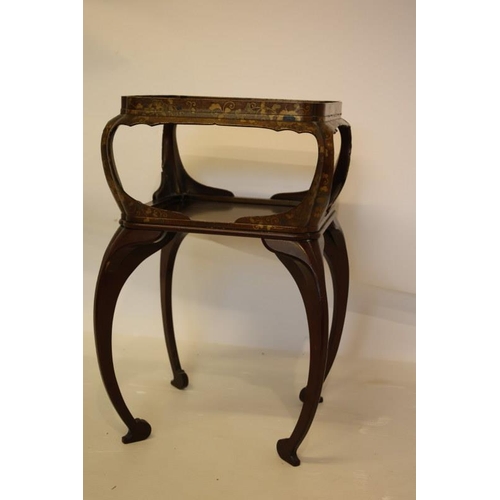 131 - Howard Berners Street, a two tier lacquered occasional table on decorative legs, stamped. H. 67cm, D... 