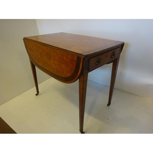 139 - A fine Regency satinwood and cross banded Pembroke table fitted with real and dummy drawers and rais... 