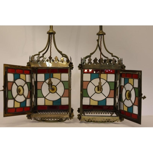 143 - A very good pair of antique stained glass and brass framed hall lanterns. Overall height 110cm.