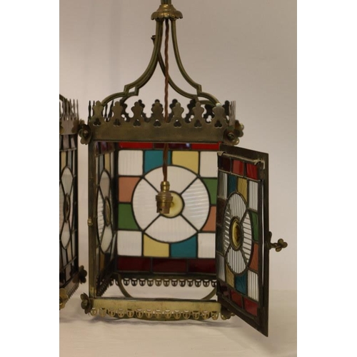 143 - A very good pair of antique stained glass and brass framed hall lanterns. Overall height 110cm.