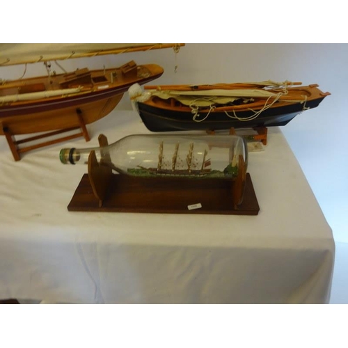 15 - Sailing & fishing boat on stands and a ship in a bottle. (3)