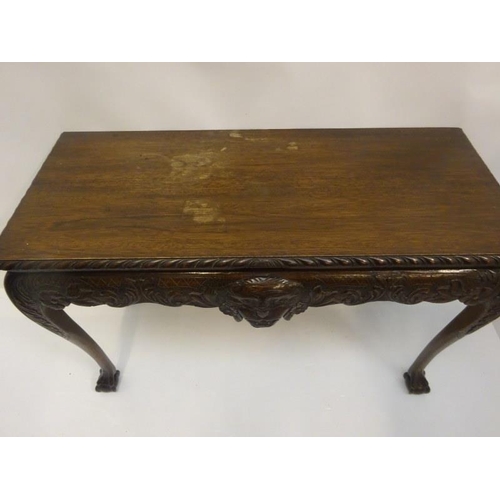 151 - Irish design mahogany side table raised on ball and claw feet. W. 122cm, D. 56cm, H. 80cm approx.