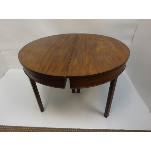 156 - A pair of Georgian mahogany demi lune tables raised on square chamfered legs. W. 120cm, D. 60cm, H. ... 