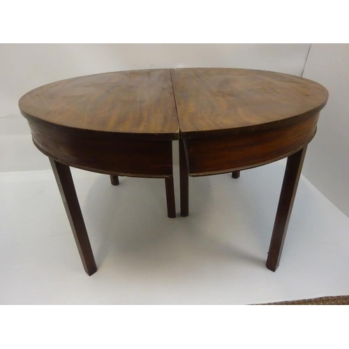 156 - A pair of Georgian mahogany demi lune tables raised on square chamfered legs. W. 120cm, D. 60cm, H. ... 