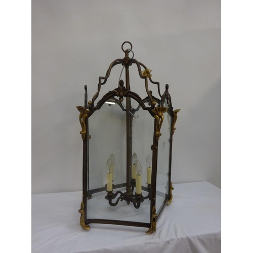 157 - Large brass framed and glass panel hall lantern. H. 88cm, Diameter 50cm approx.