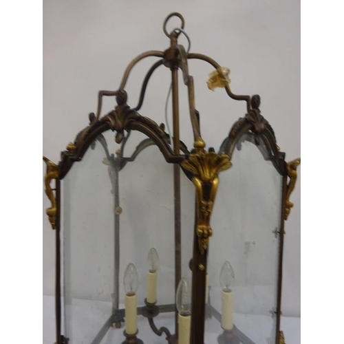 157 - Large brass framed and glass panel hall lantern. H. 88cm, Diameter 50cm approx.