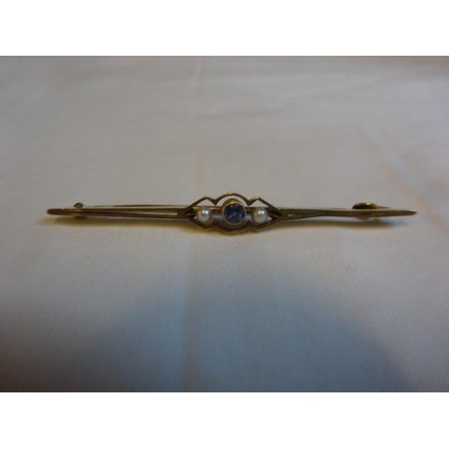 183 - 15ct gold bar brooch with pearls and coloured stone.