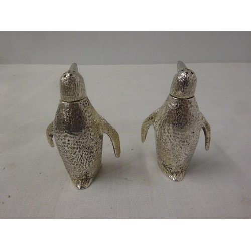 187 - A pair of silver plated cruets in the shape of penguins.