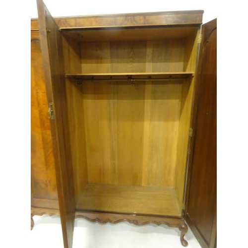 232 - Waring & Gillow - A good Edwardian mahogany wardrobe having bevelled glass full length mirror and th... 