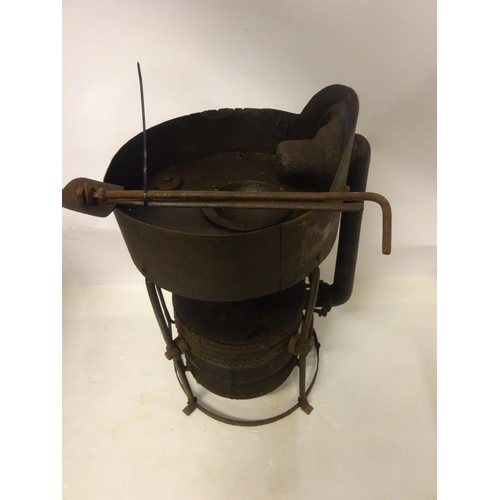 249 - A rare old 19th century portable forge complete with handle and shovel. H. 95cm, Diameter 50cm.