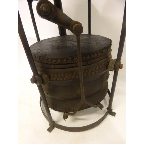 249 - A rare old 19th century portable forge complete with handle and shovel. H. 95cm, Diameter 50cm.