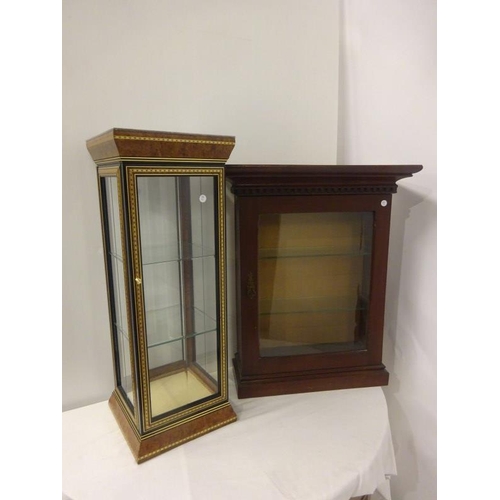 256 - Two neat sized table top display cabinets.
(H. 75cm, W. 60cm, D. 23cm). (H. 82cm, W. 30cm, D. 30cm)