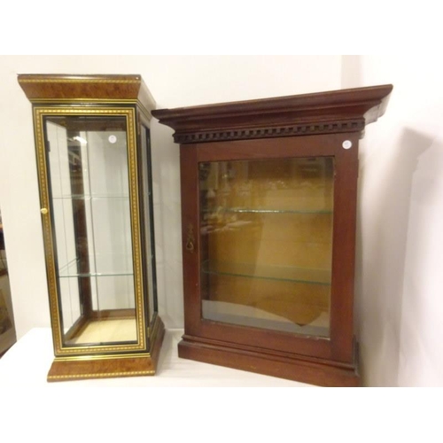 256 - Two neat sized table top display cabinets.
(H. 75cm, W. 60cm, D. 23cm). (H. 82cm, W. 30cm, D. 30cm)