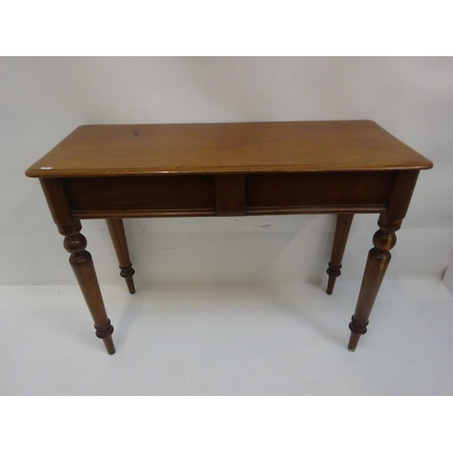 281 - Victorian mahogany side table raised on turned legs. W. 105cm, D. 40cm, H. 78cm approx.