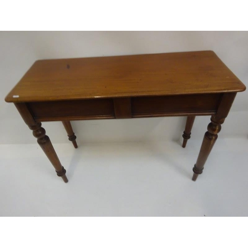 281 - Victorian mahogany side table raised on turned legs. W. 105cm, D. 40cm, H. 78cm approx.