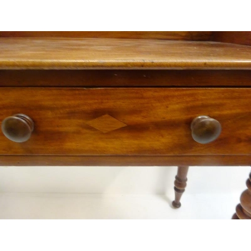 281 - Victorian mahogany side table raised on turned legs. W. 105cm, D. 40cm, H. 78cm approx.