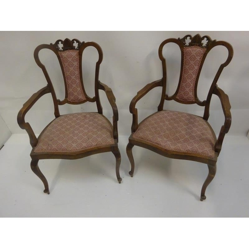 283 - A pair of Edwardian mahogany ladies drawing room chairs.