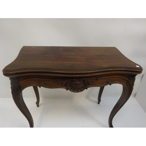 285 - Victorian rosewood fold over card table raised on cabriole legs. W. 83cm, D. 43cm, H. 75cm approx.