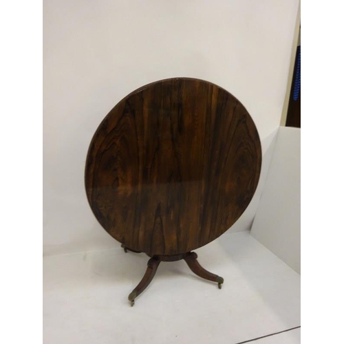 287 - A Regency rosewood circular dining table raised on turned column platform base and 4 splay legs with... 