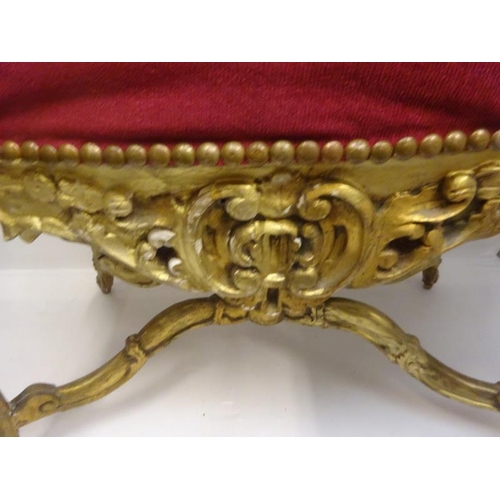 291 - Large gilt framed seat raised on shaped legs and cross stretcher with urn finial. W. 112cm, H. 70cm,... 