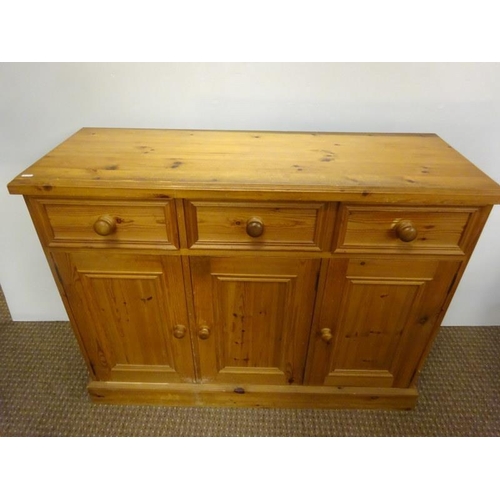 294 - Pine side cabinet fitted with drawers and cupboards. W. 120cm, D. 45cm, H. 93cm approx.