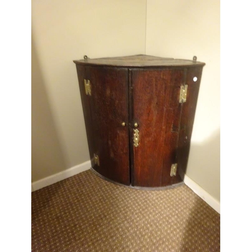 297 - Georgian oak hanging corner cupboard. H. 80cm, D. 40cm , W. 70cm approx.