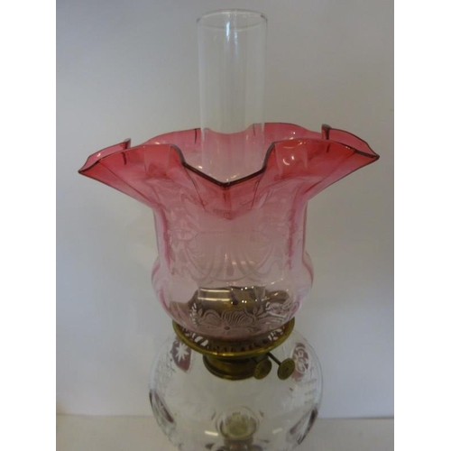 322 - Antique brass column oil lamp having clear glass bowl with red glass decoration and red glass shade ... 