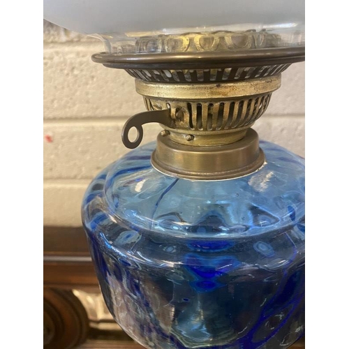 329 - Tall brass column oil lamp with blue glass bowl and shade (crack in bowl, see photo). H. 94cm.