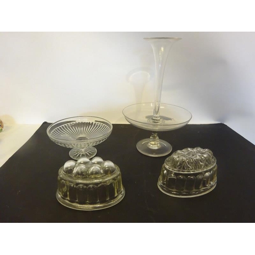 330 - Two old glass jelly moulds, glass bowl and glass table centre piece. (4)