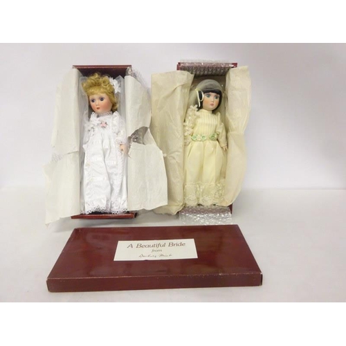 342 - Two boxed dolls.