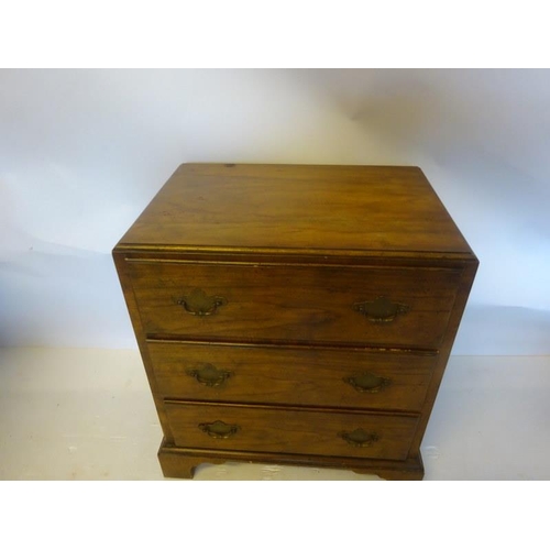 348 - Neat sized walnut chest of three drawers on bracket feet. 
W. 57cm, D. 39cm, H. 65cm.