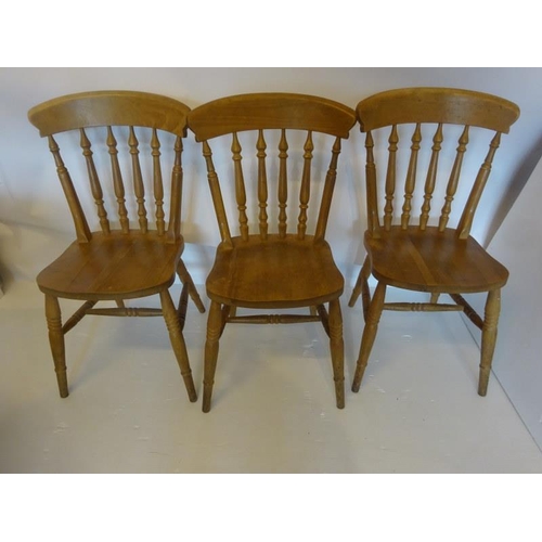 353 - Three pine kitchen chairs.