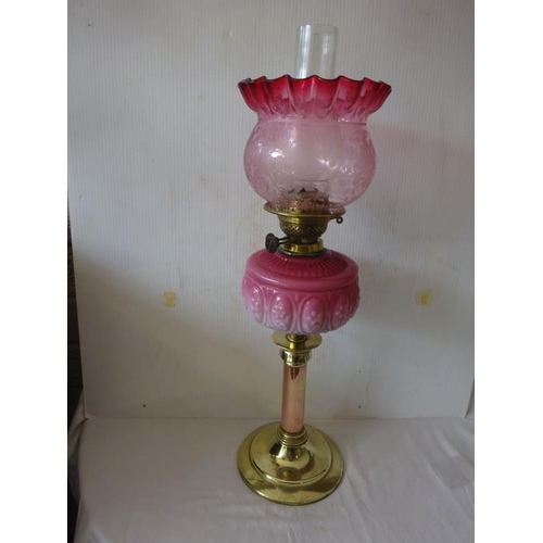 359 - Victorian brass oil lamp with quilted bowl and red shade.