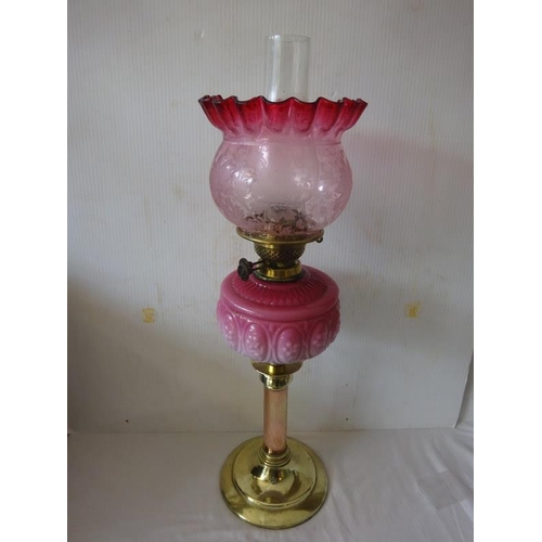 359 - Victorian brass oil lamp with quilted bowl and red shade.