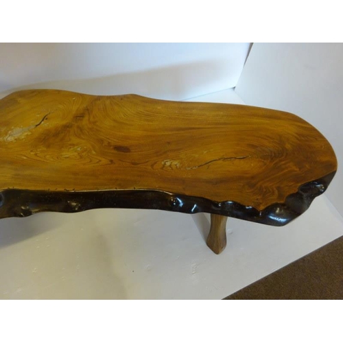 36 - A long timber shaped hall table (made from a tree that fell in the estate). L. 222cm, H. 42cm.