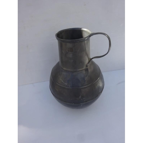 369 - Large old Pewter jug with handle. H. 50cm.