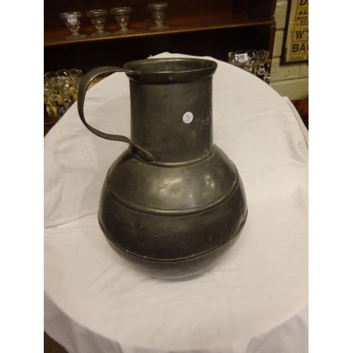 369 - Large old Pewter jug with handle. H. 50cm.